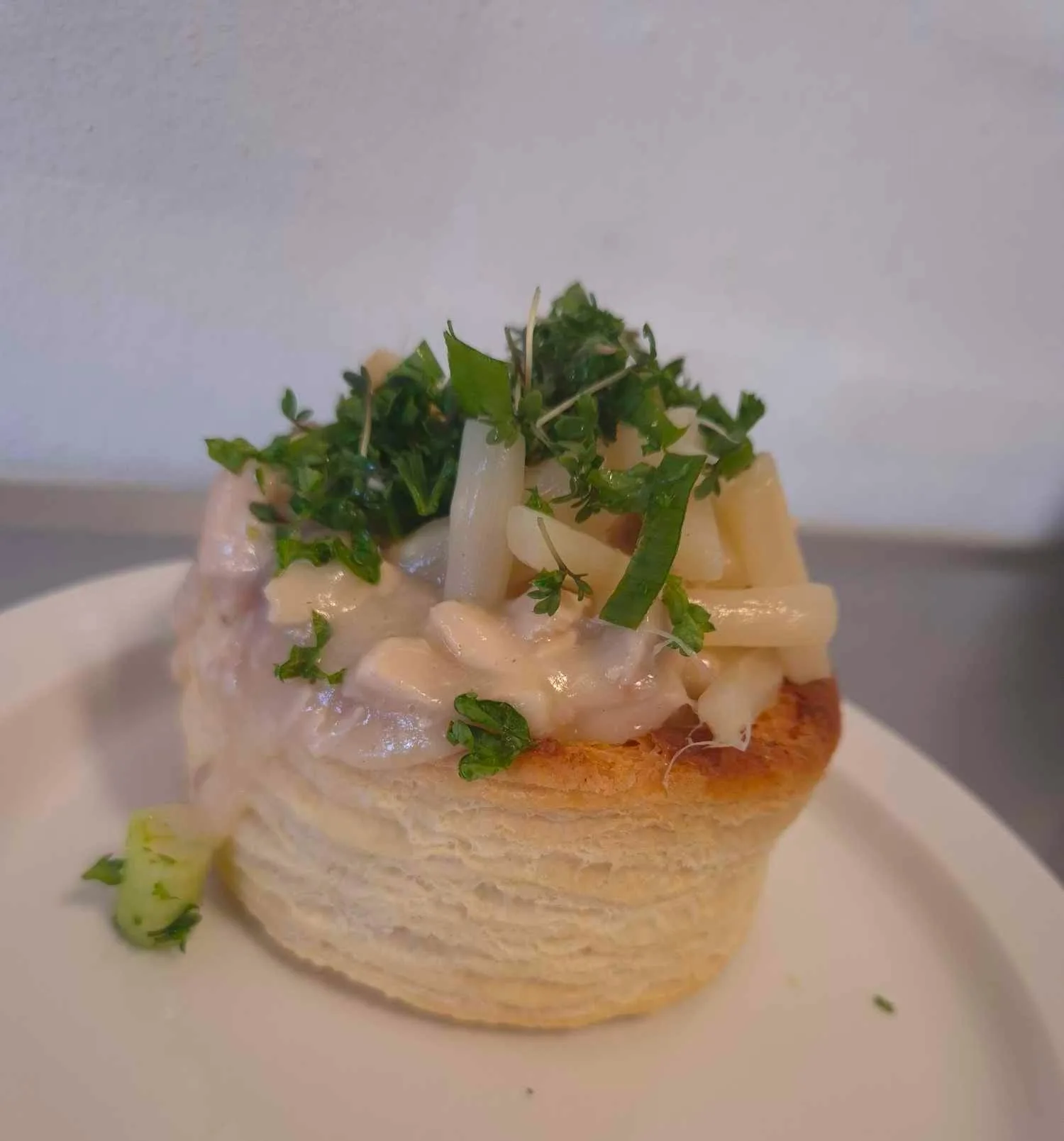 Puff pastry vol-au-vent with creamy chicken and herbs.