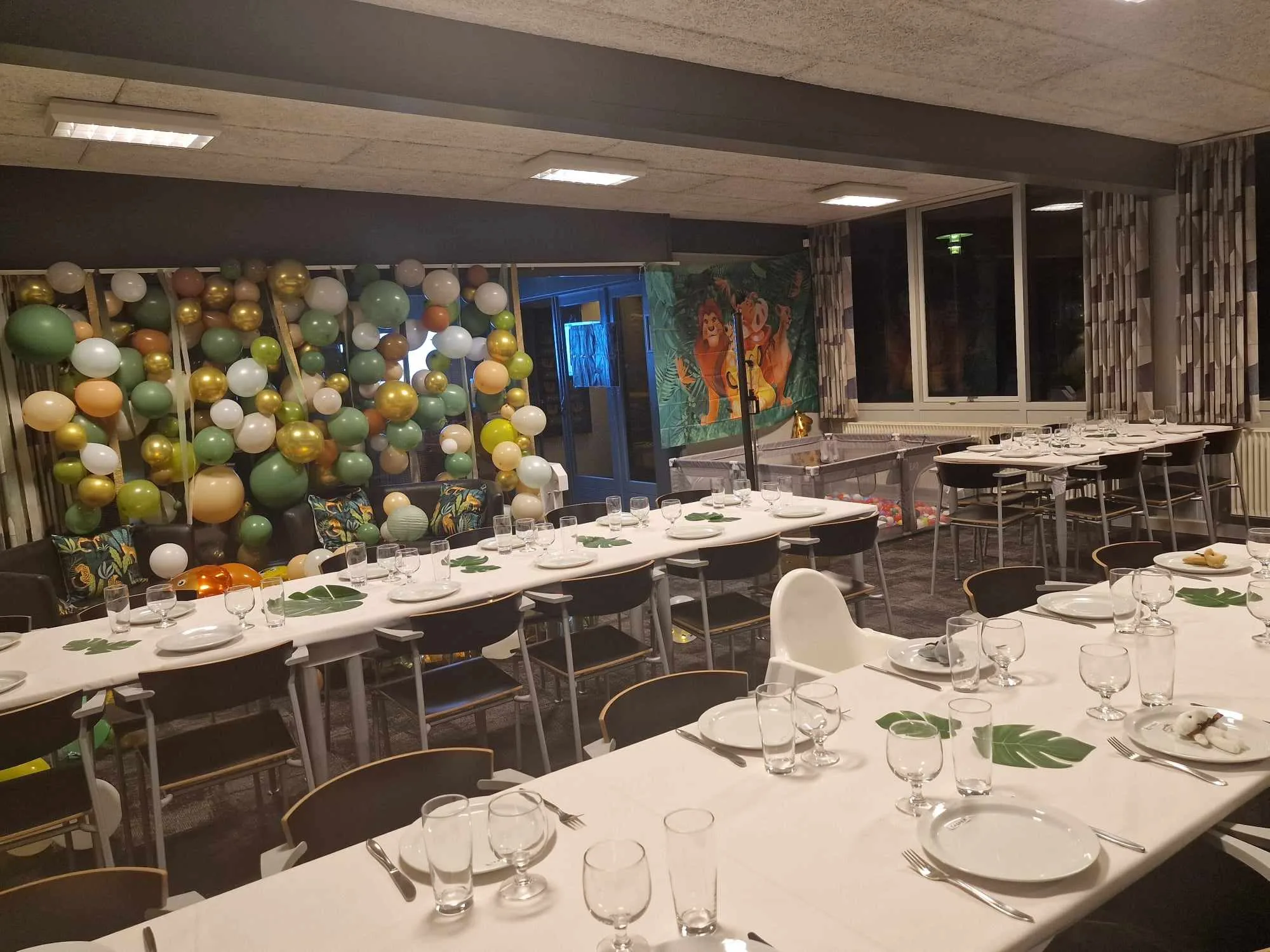 Balloon-decorated dining room prepared for a party.